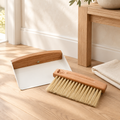 Brown brush and white dustpan in a luxury entryway